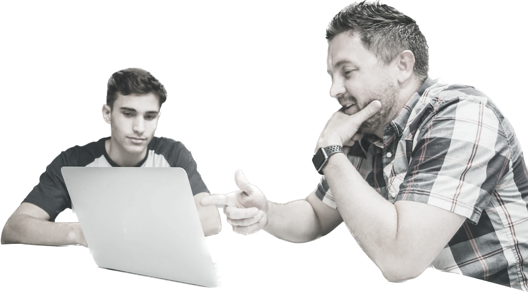 Two men collaborating over a laptop